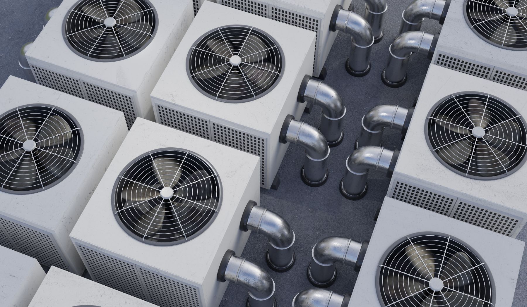 Multiple white HVAC units with black fan grilles and metal exhaust ducts arranged on rooftop